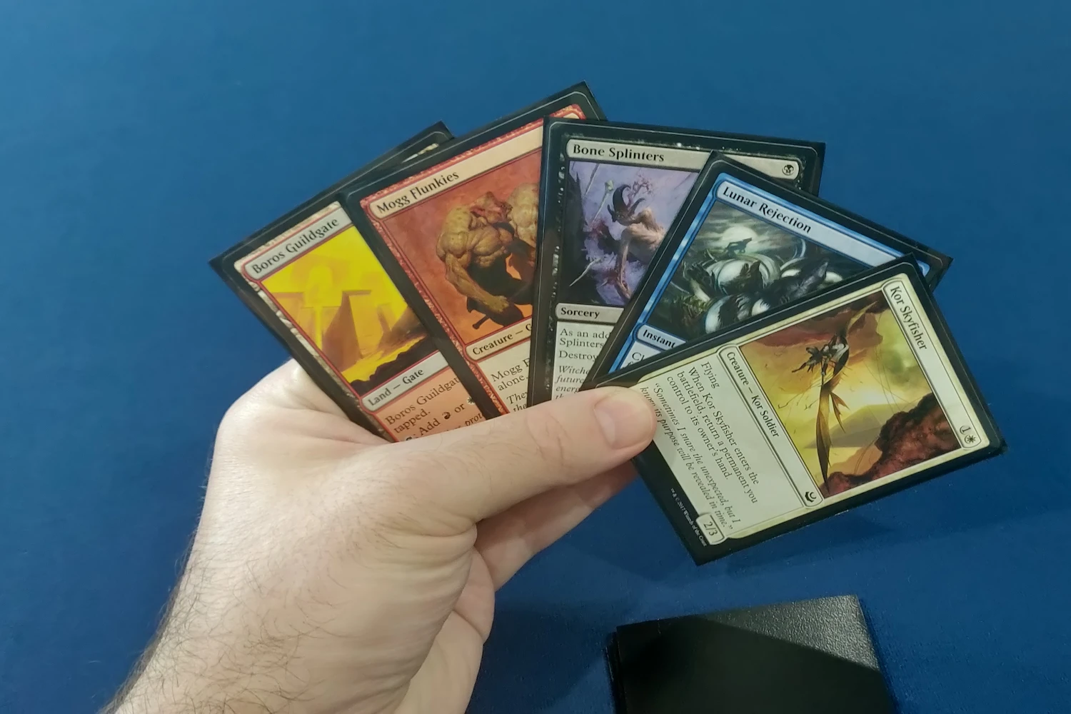 A small selection of cards all with drawbacks: Boros Guildgate, Mogg Flunkies, Bone Splinters, Lunar Rejection, Kor Skyfisher