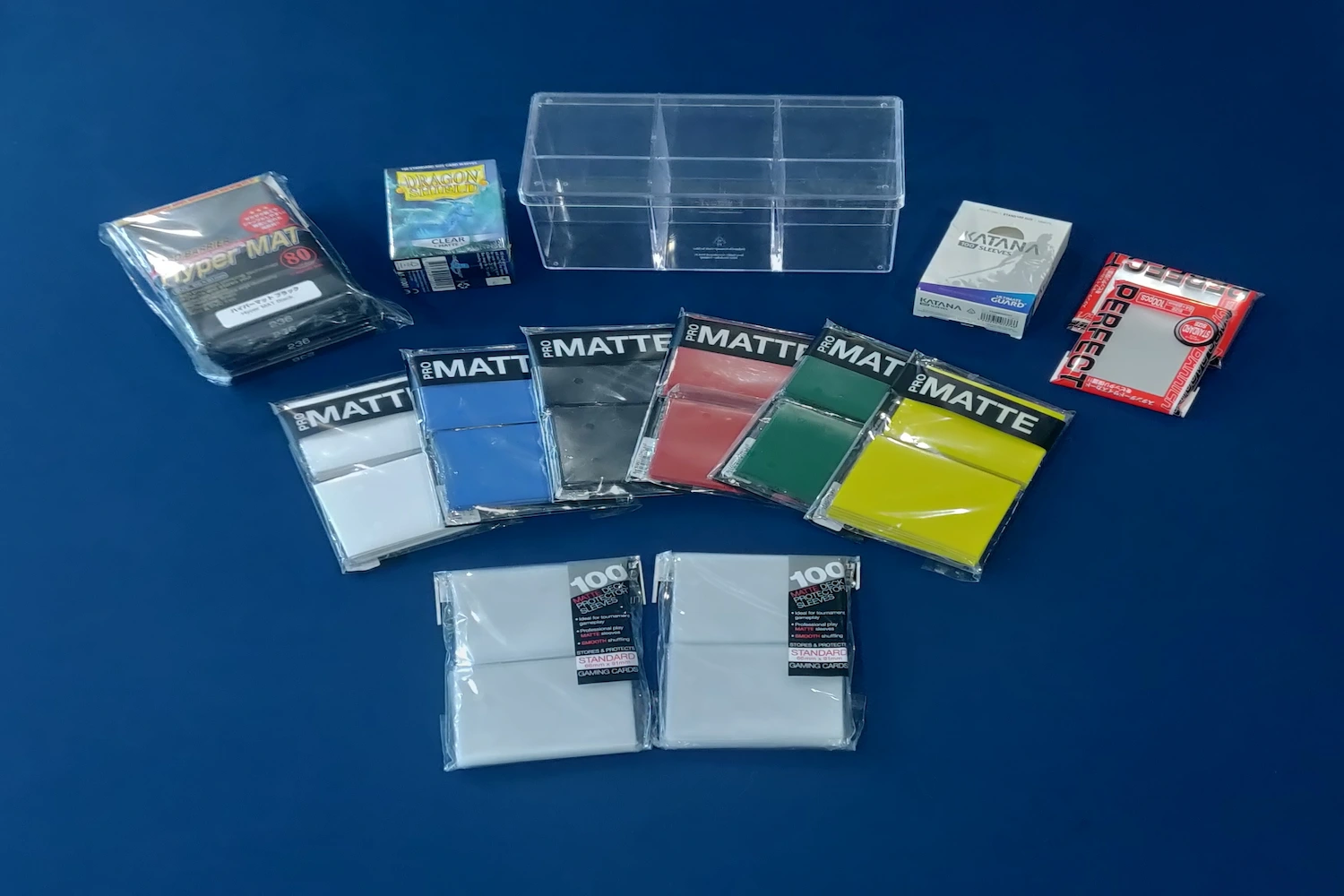 A collection of different card sleeves in the middle of a table